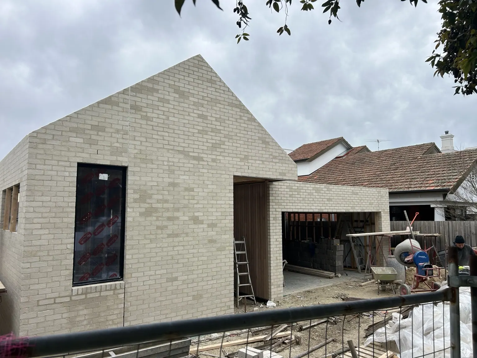 Light brick contemporary residence with gable end